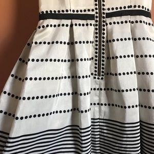 Comes down to Mid thigh or knees depends on height